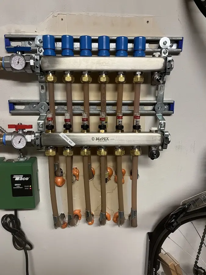 Plumber performing Water Heater Repair at a residential property in North Coventry